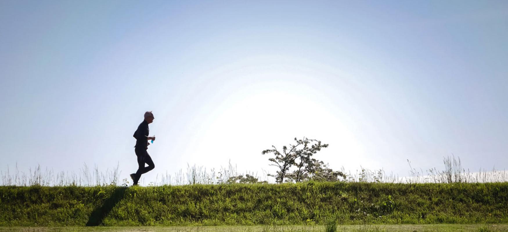 Man running on the horizon.
