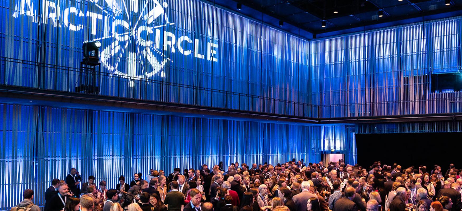 Arctic Circle Assembly Iceland reception hall full of people mingling