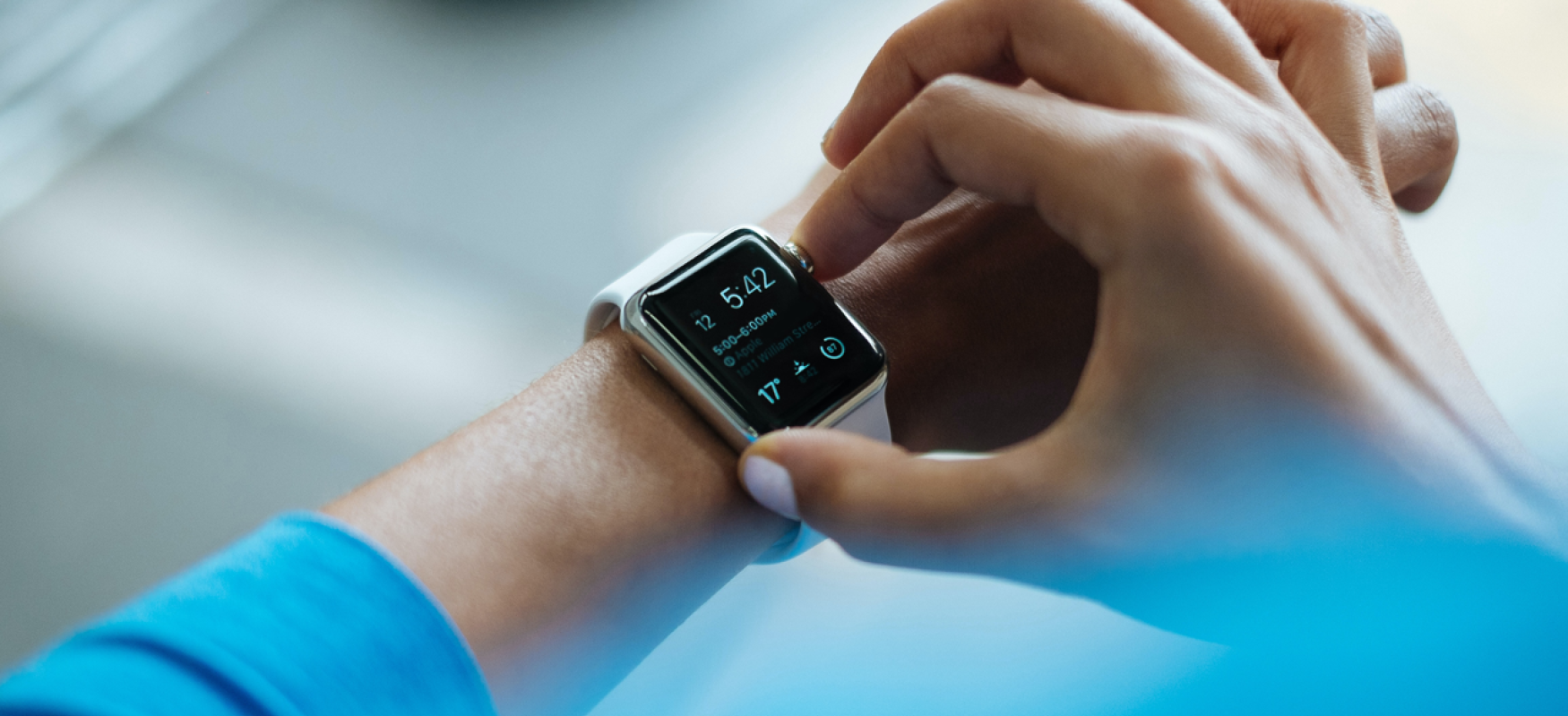 Person checking his Apple watch. Photo: Luke Chesser