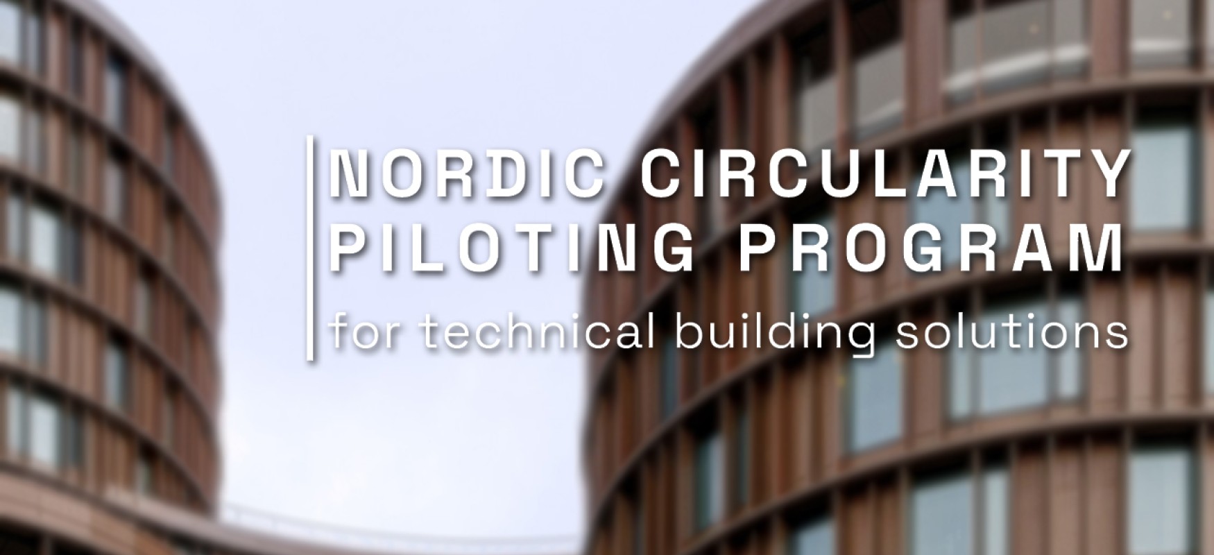 Nordic Circularity Pilot logo over blurry image of a city