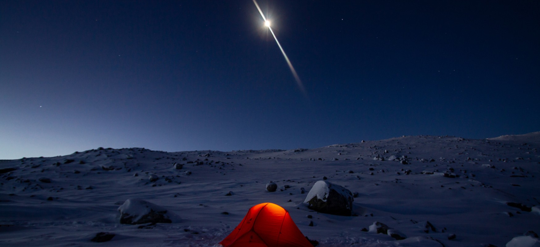 Tent in winter night with clear moon