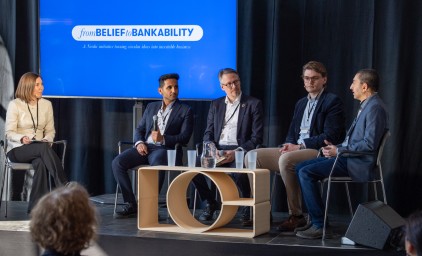 Benedicte Sognefest moderating a panel discussion with four participants