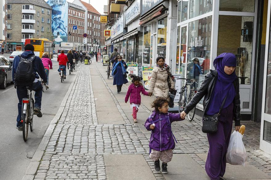 People walking and biking in Nørrebro, Copenhagen.