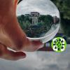 Image: Maiken Ingvordsen, Unsplash Person holding glass globe with reflecting building and trees in the background. WCEFonline sideevent logo