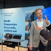 Emil talking to a person attending our stand at Arctic Circle Assembly